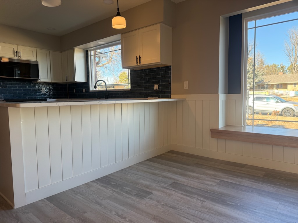 Kitchen renovation with shaker cabinets and luxury vinyl plank flooring